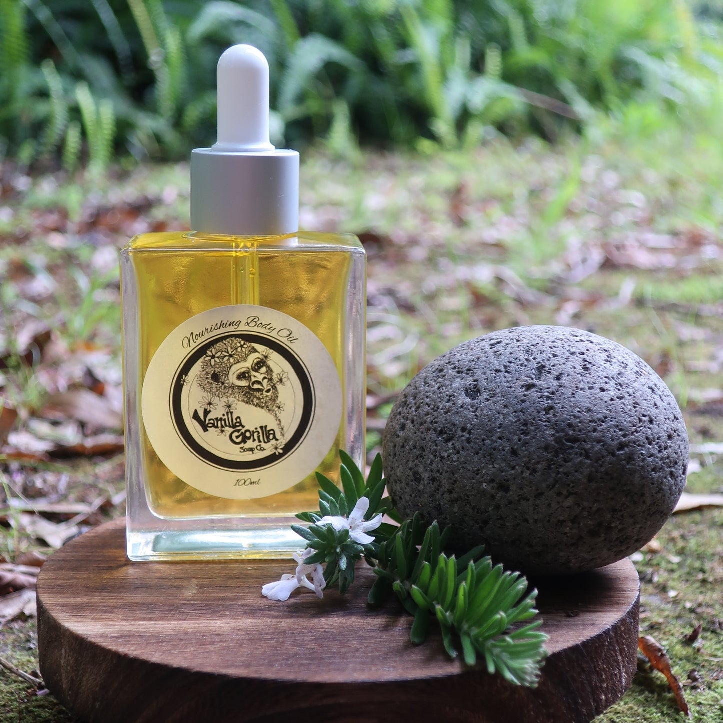 body oil with vanilla gorilla brand in natural setting