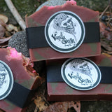 Three bars of sweet candy apple bar soap with 'Vanilla Gorilla ' branding on a leafy background