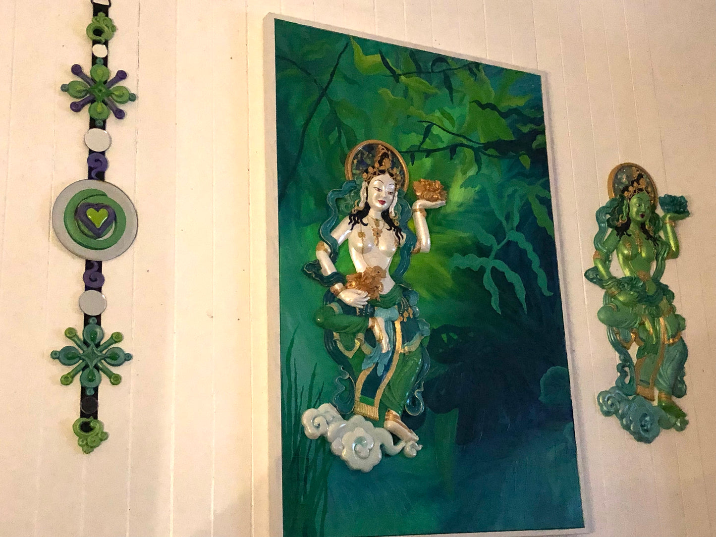 Wall with jungle goddess in green, a free floating goddess and dangly