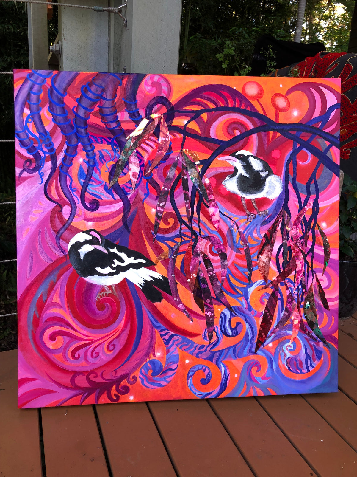 Colourful swirling art of orange and blues and purples with 2 pee wees oil on canvas 