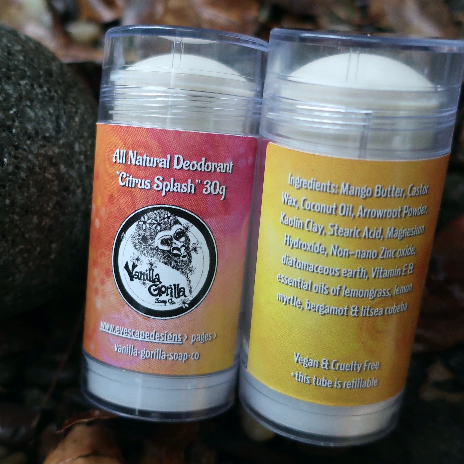 Two containers of all natural  citrus splash deodorant with vanilla gorilla labels on a natural background.