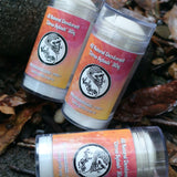 Two bottles of 'Vanilla Gorilla'  citrus splash all natural deodorant on a leafy background