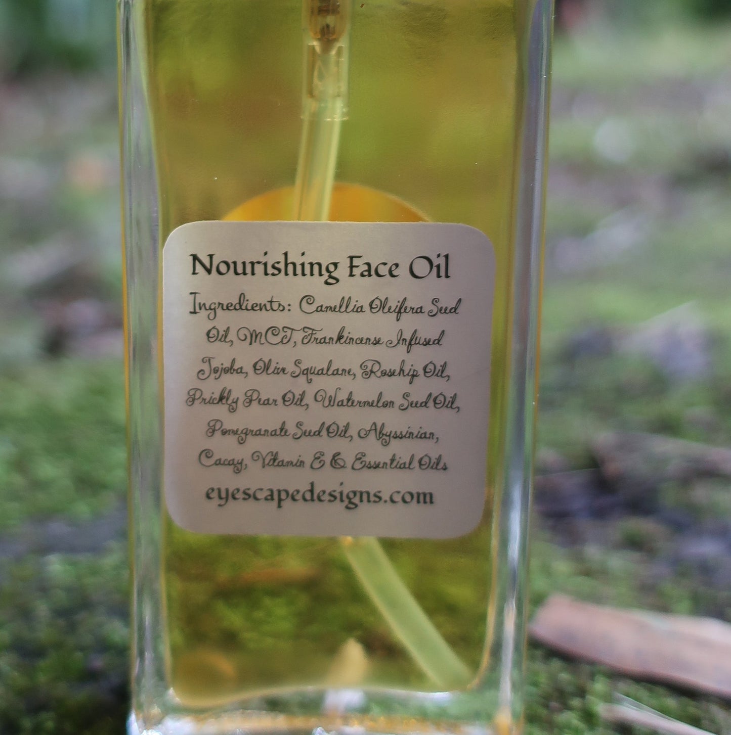 Bottle of 'Nourishing face' oil with a label on a natural background