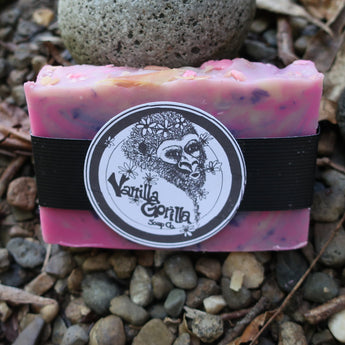Bar of pink/purple soap with a Vanilla Gorilla label on a stone surface