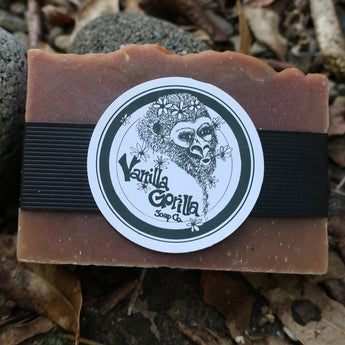 Bar of musk soap with a 'Vanilla Gorilla Soap Co.' label on a natural background