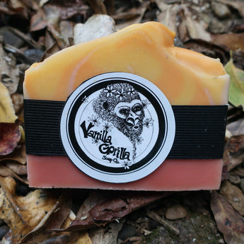 Bar of soap with a Vanilla Gorilla Soap Co. label on a leafy background