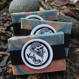Colorful soap bars with a brand logo on a natural background