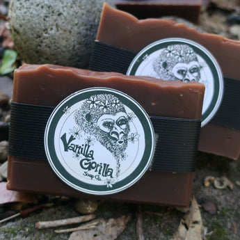 Two bars of soap with 'Vanilla Gorilla Soap Co.' labels on a natural background.