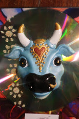 light blue Karma Cow CD fridge magnet 