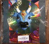 CD mounted with blue cow funky fridge magnet