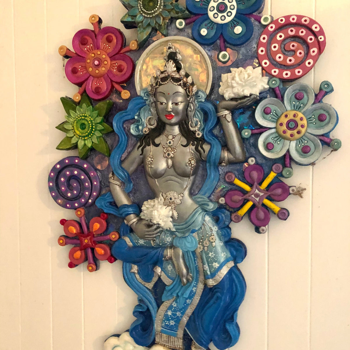 Decorative wall piece with a central dakini figure surrounded by colorful flowers on a light background 3dimensional wall art