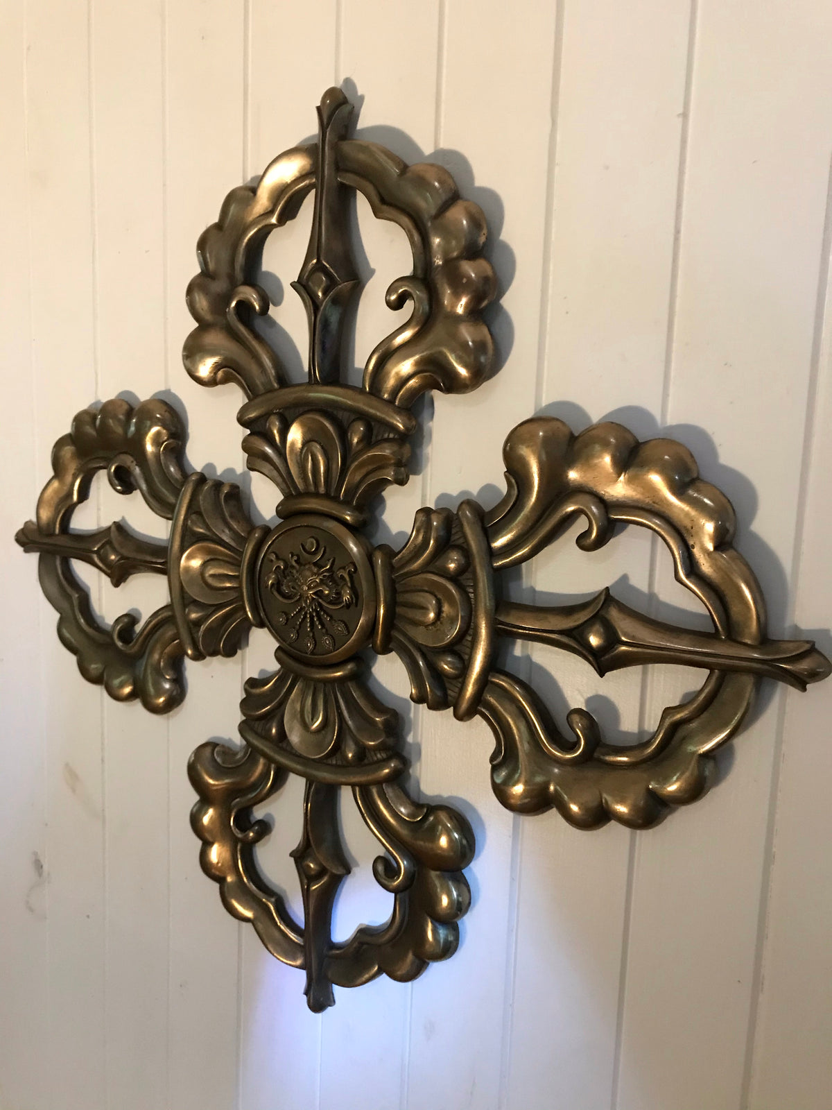 solid bronze wall art - double vajra on white wall
