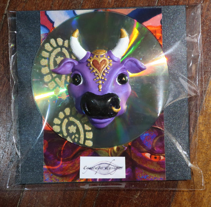 Purple Karma Cow fridge magnet on up cycled CD
