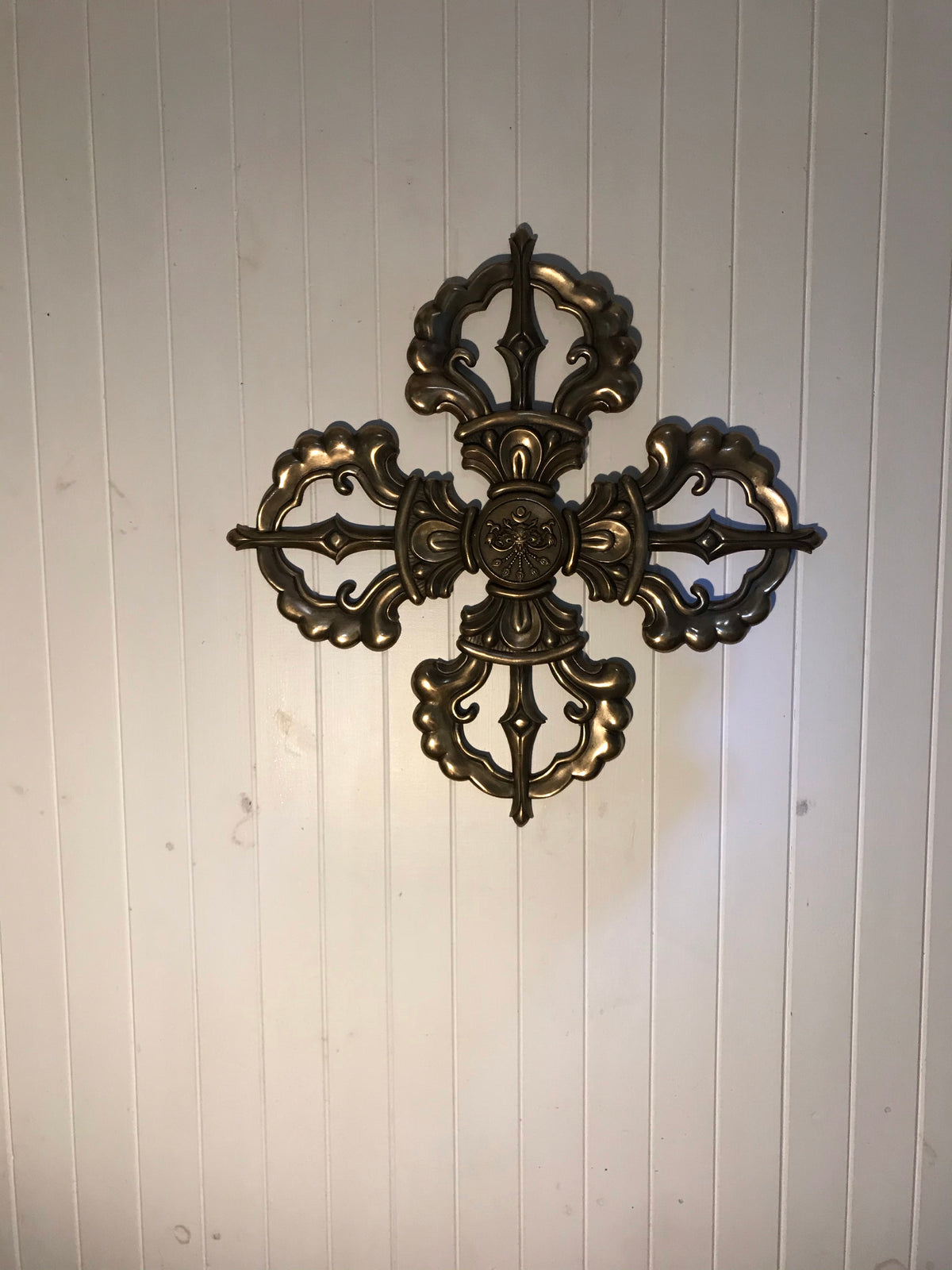 investment cast bronze dorje hanging on a wall