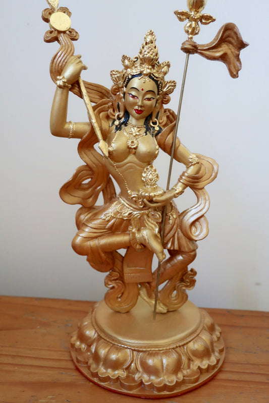 Golden Mandarava Statue on a white background